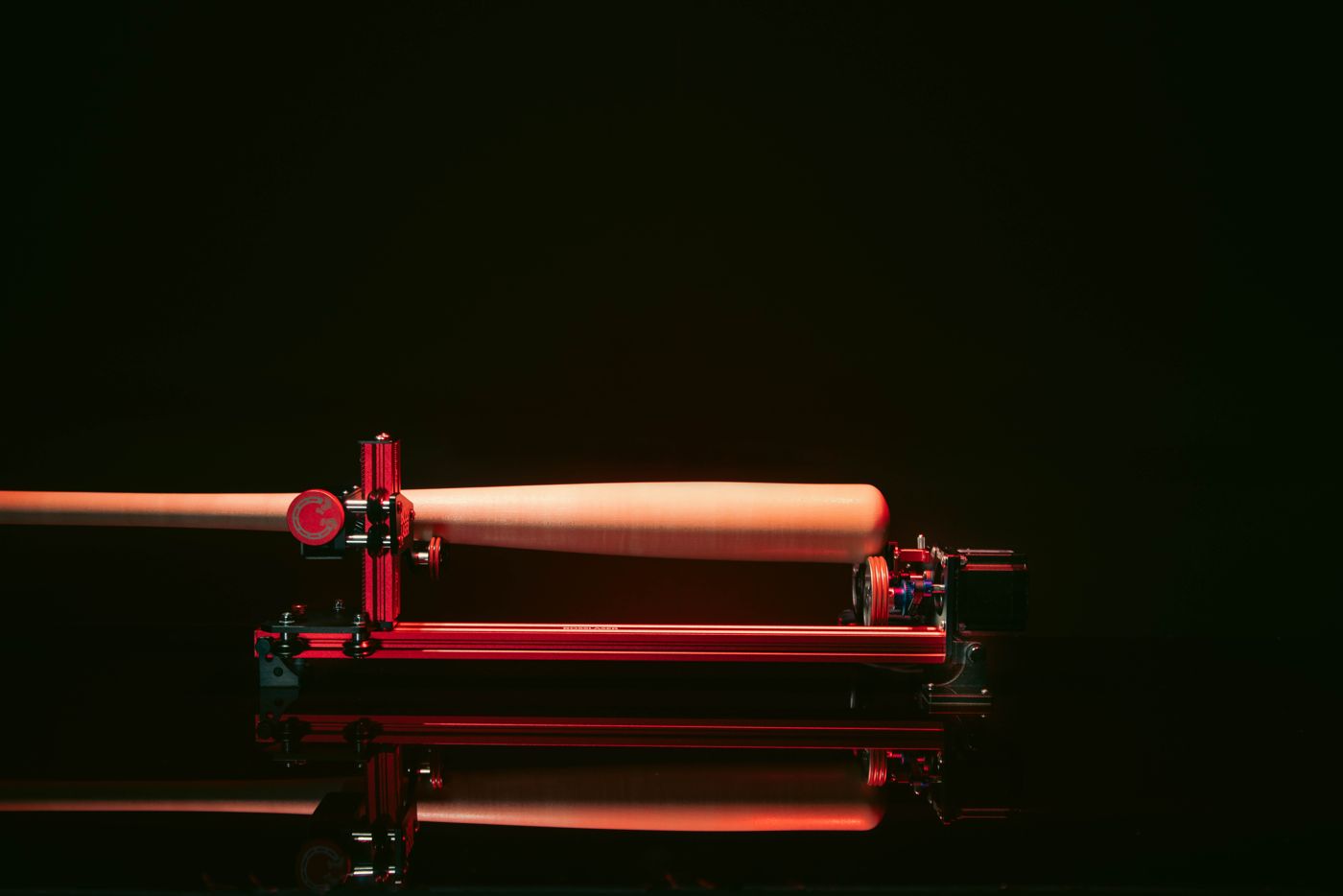 Wooden baseball bat mounted across the PiBurn rotary