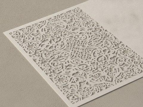 Intricate laser-cut paper and cardstock pieces
