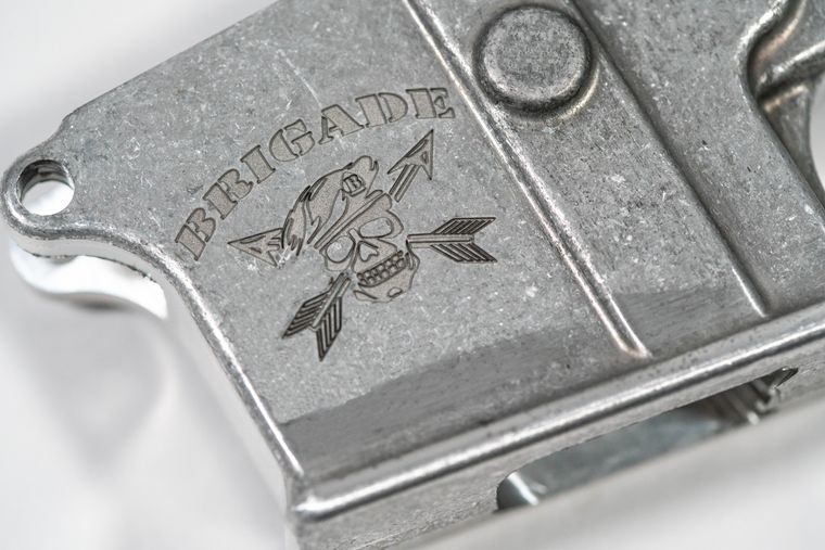 Fiber laser surface etching, high-contrast decorative mark on metal