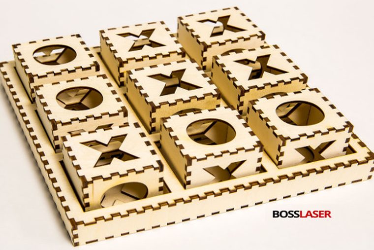 Laser-cut wooden game set assembled with finger-joint box joinery