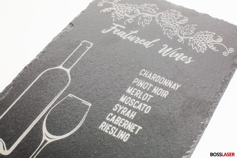 Wine menu artwork laser engraved into a natural-edge slate board
