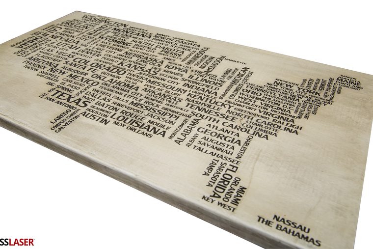 US map word art raster engraved into a wood panel on a Boss laser