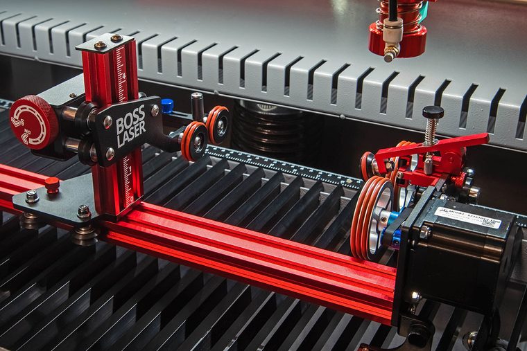 PiBurn rotary attachment installed on a Boss laser bed for cylindrical engraving
