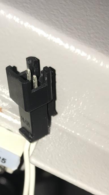 Door sensor male connector with multimeter leads on the prongs