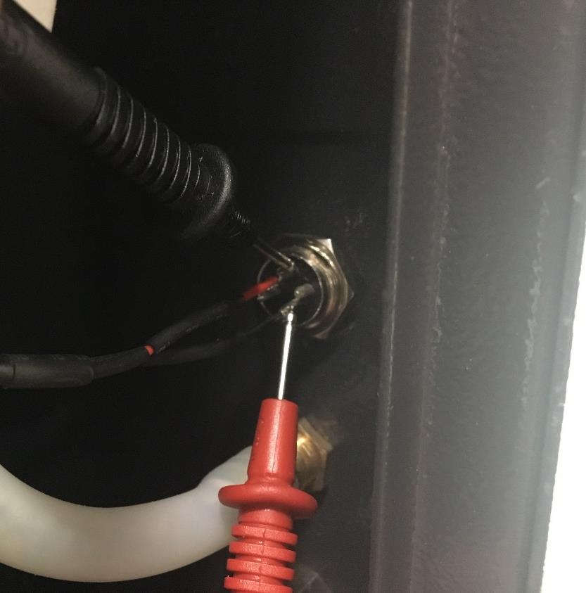 Multimeter leads inside the chiller signal port
